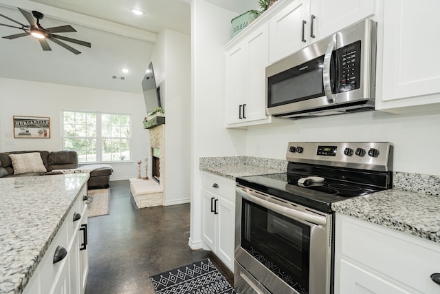 13530 Hiram Rd, Wills Point, TX 75169 - kitchen featuring appliances with stainless steel finishes, open floor plan, white cabinets, concrete flooring, and recessed lighting