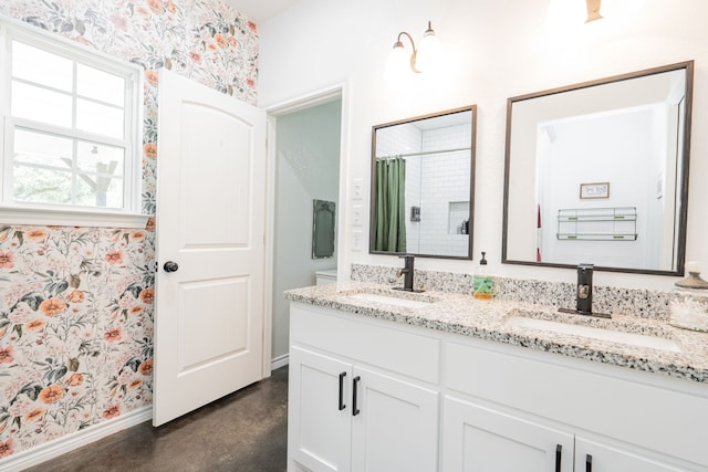 13530 Hiram Rd, Wills Point, TX 75169 - full bathroom featuring wallpapered walls, double vanity, baseboards, a shower with curtain, and concrete floors