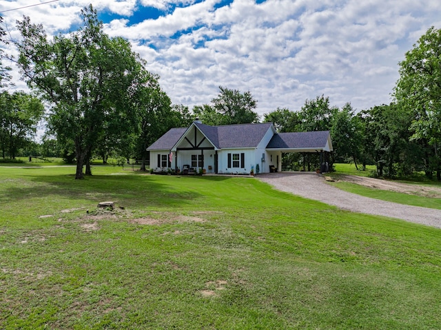 13530 Hiram Rd, Wills Point, TX 75169 - view of front of property featuring driveway, covered porch, a front yard, and a carport