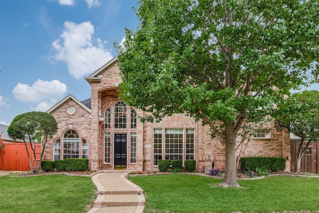 7905 Cherry Creek Dr, Plano, TX 75025 - view of front of home with brick siding and a gate