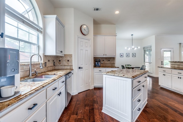 7905 Cherry Creek Dr, Plano, TX 75025 - kitchen with a sink, stainless steel dishwasher, backsplash, a chandelier, and recessed lighting