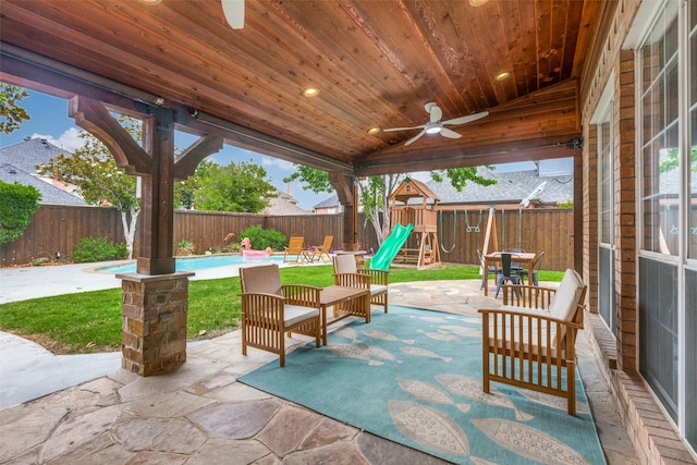 7905 Cherry Creek Dr, Plano, TX 75025 - fenced backyard featuring a ceiling fan, a playground, and a patio area