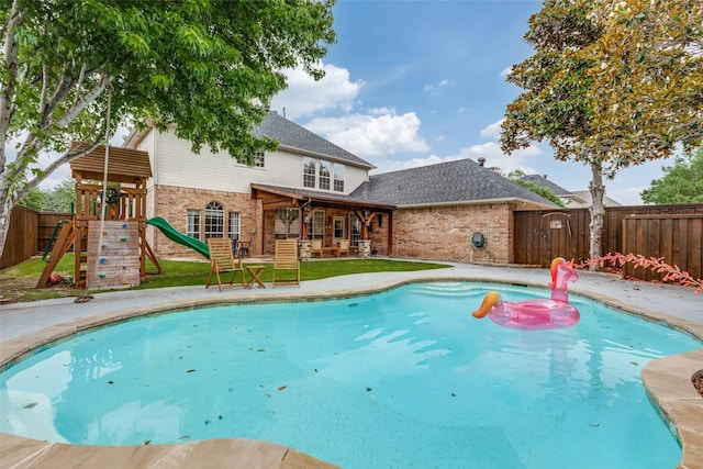 7905 Cherry Creek Dr, Plano, TX 75025 - view of pool with a patio, a fenced backyard, and a playground