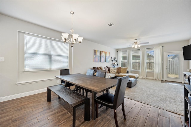 612 Redwood Dr, Greenville, TX 75402 - dining area with wood finished floors, a ceiling fan, a chandelier, and baseboards