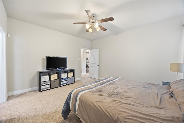 612 Redwood Dr, Greenville, TX 75402 - bedroom featuring light carpet, baseboards, and a ceiling fan