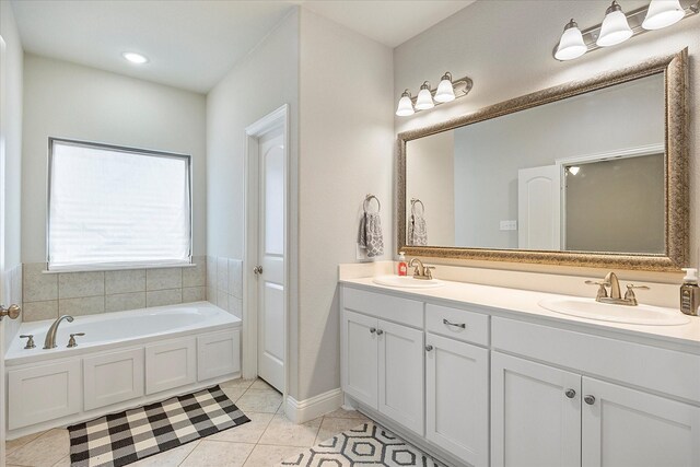 612 Redwood Dr, Greenville, TX 75402 - bathroom featuring double vanity, a bath, and tile patterned flooring