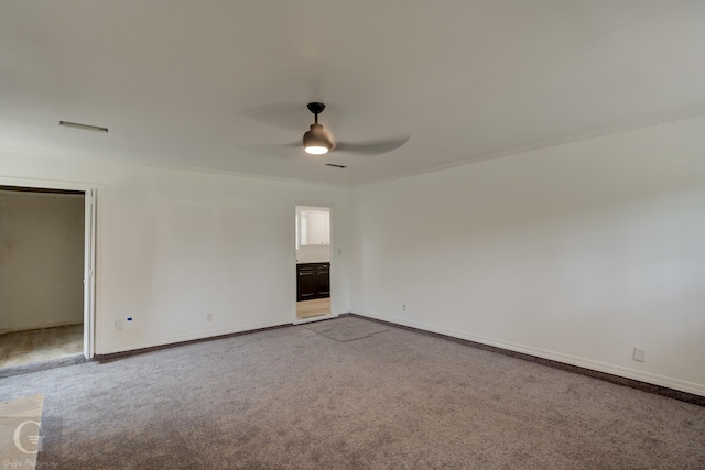 2031 Beth Ln, Shreveport, LA 71118 - spare room featuring a ceiling fan, carpet, baseboards, and crown molding