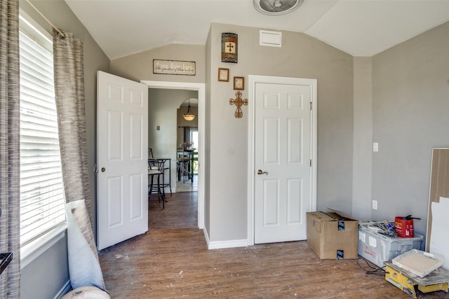 6980 Prather Rd, Springtown, TX 76082 - unfurnished bedroom featuring lofted ceiling, wood finished floors, and baseboards