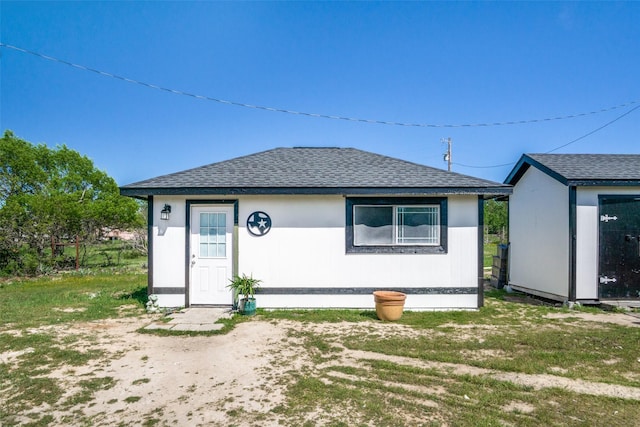 6980 Prather Rd, Springtown, TX 76082 - view of front of property featuring a shingled roof and an outdoor structure