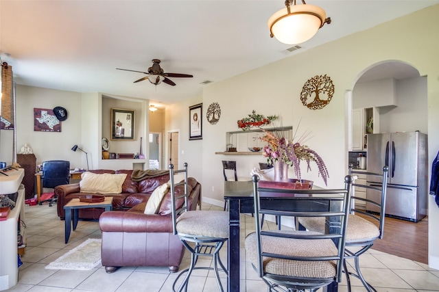6980 Prather Rd, Springtown, TX 76082 - living room featuring arched walkways, light tile patterned floors, and ceiling fan