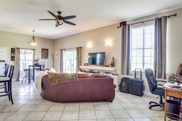 6980 Prather Rd, Springtown, TX 76082 - living room featuring ceiling fan, light tile patterned flooring, and healthy amount of natural light