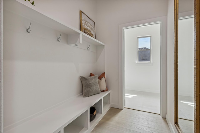 4521 Rustic Ridge Dr, Mckinney, TX 75071 - mudroom with light wood finished floors and baseboards