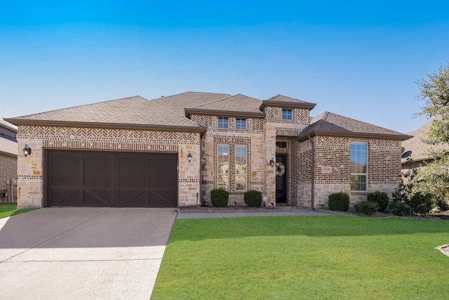 1305 Xeraco Dr, Little Elm, TX 75068 - view of front of home with brick siding, an attached garage, a front lawn, driveway, and stone siding