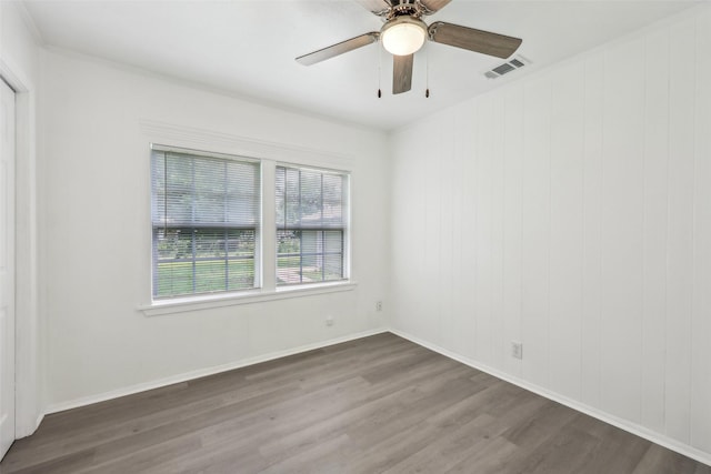 1320 Dale Dr, Garland, TX 75041 - empty room featuring wood finished floors, ceiling fan, and baseboards