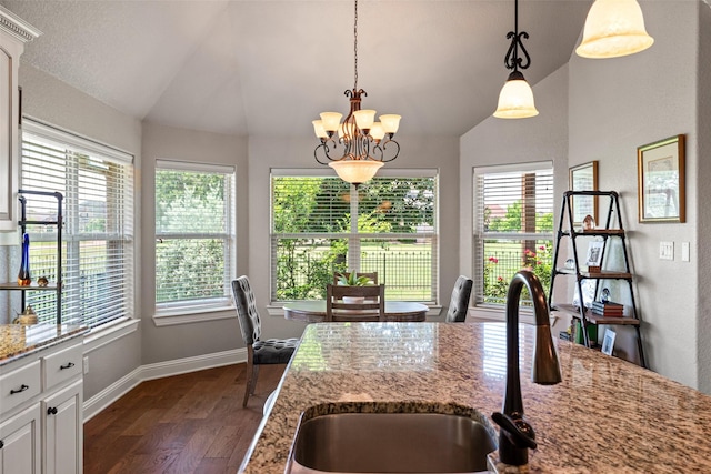 3303 Ferry Boat Ln, Granbury, TX 76049 - dining room featuring lofted ceiling, a chandelier, dark wood finished floors, and baseboards