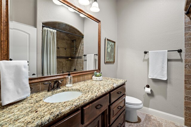 3303 Ferry Boat Ln, Granbury, TX 76049 - bathroom with toilet, vanity, and tiled shower