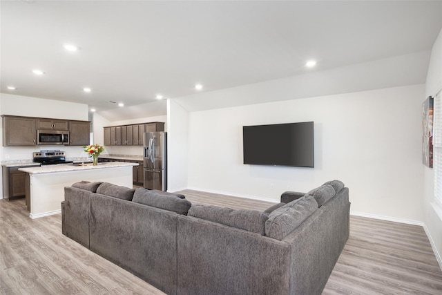 100 Samuel St, Denton, TX 76207 - living area with light wood-style flooring, baseboards, and recessed lighting