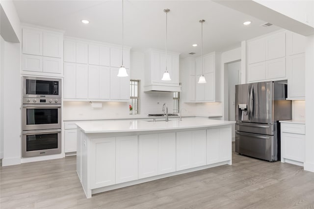 2130 Lassen Dr, Prosper, TX 75078 - kitchen with appliances with stainless steel finishes, light countertops, light wood-style flooring, and recessed lighting