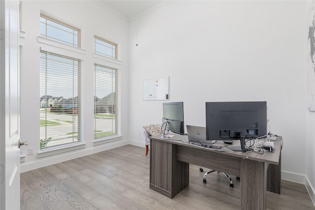 2130 Lassen Dr, Prosper, TX 75078 - office area featuring ornamental molding, healthy amount of natural light, wood finished floors, and baseboards