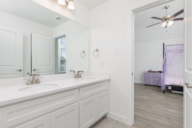 2130 Lassen Dr, Prosper, TX 75078 - bathroom featuring double vanity, ensuite bath, a ceiling fan, and baseboards