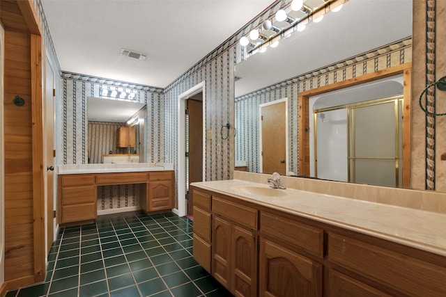 492 Russell Ln, Denison, TX 75021 - full bath featuring wallpapered walls, vanity, tile patterned flooring, and a stall shower
