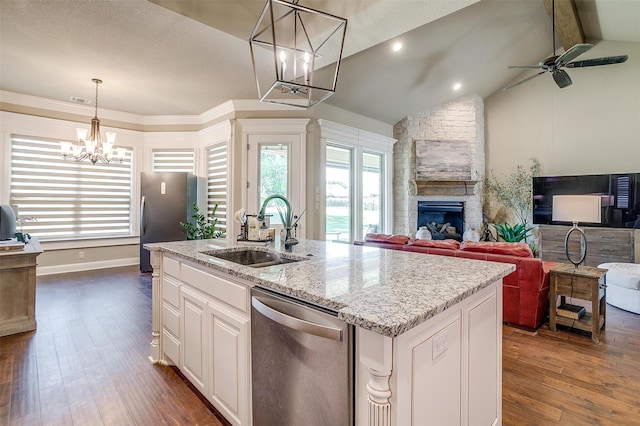 3201 Steamers Ct, Granbury, TX 76049 - kitchen featuring appliances with stainless steel finishes, a sink, a chandelier, and healthy amount of natural light