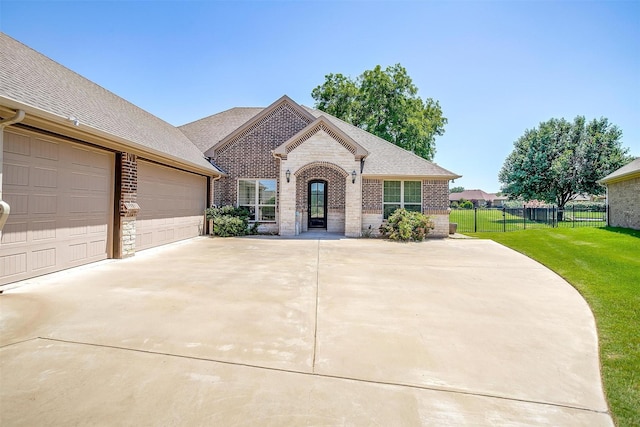 3201 Steamers Ct, Granbury, TX 76049 - french provincial home featuring brick siding, driveway, and stone siding