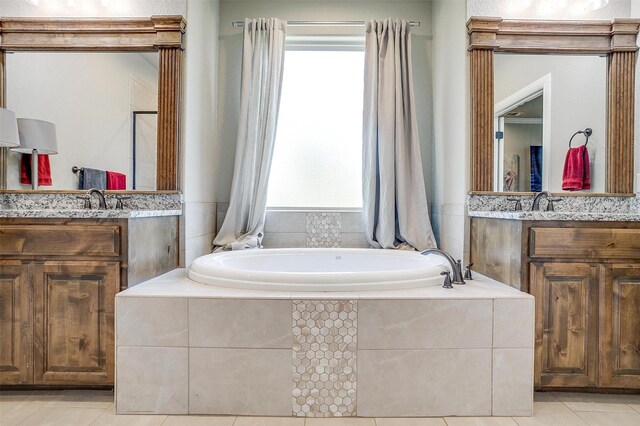 3201 Steamers Ct, Granbury, TX 76049 - bathroom with plenty of natural light, a garden tub, and tile patterned flooring