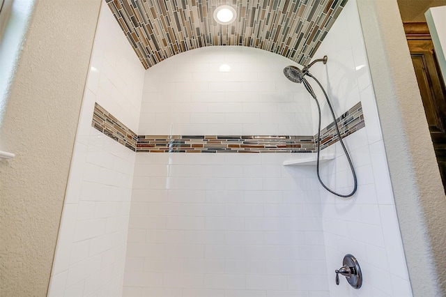 3201 Steamers Ct, Granbury, TX 76049 - bathroom view of tiled shower and a textured wall