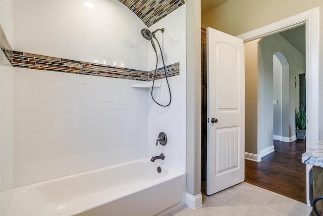 3201 Steamers Ct, Granbury, TX 76049 - bathroom featuring  shower combination, baseboards, a textured wall, and tile patterned floors