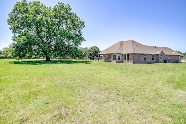3201 Steamers Ct, Granbury, TX 76049 - view of grassy yard with central air condition unit