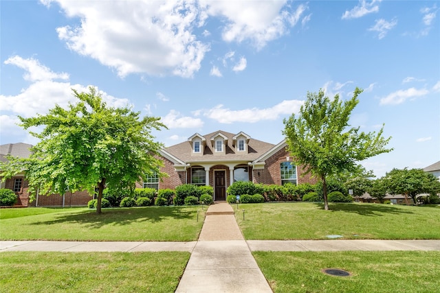 2901 NE Regents Park Ln, Garland, TX 75043 - view of front of property featuring brick siding, a front yard, and a shingled roof