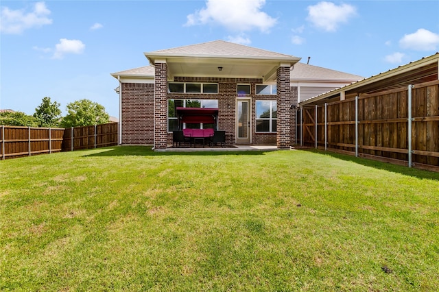 2901 NE Regents Park Ln, Garland, TX 75043 - rear view of property with brick siding, a patio, and roof with shingles