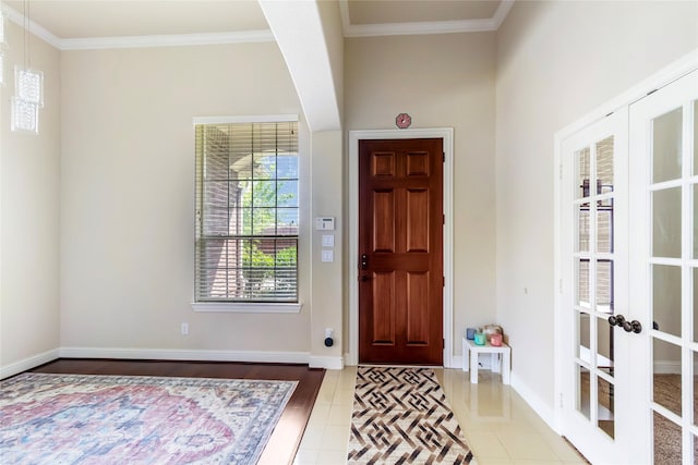 2901 NE Regents Park Ln, Garland, TX 75043 - tiled entrance foyer featuring french doors, crown molding, and baseboards