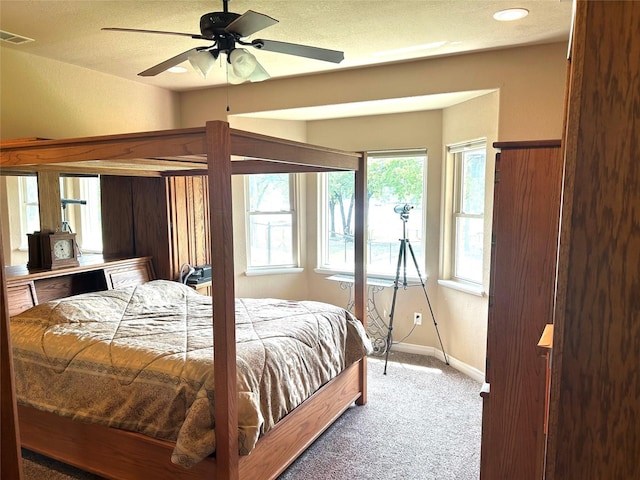 2663 Rodeo Dr, Quinlan, TX 75474 - bedroom featuring light colored carpet, baseboards, and a ceiling fan