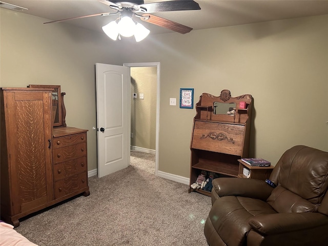 2663 Rodeo Dr, Quinlan, TX 75474 - sitting room featuring a ceiling fan, light colored carpet, and baseboards