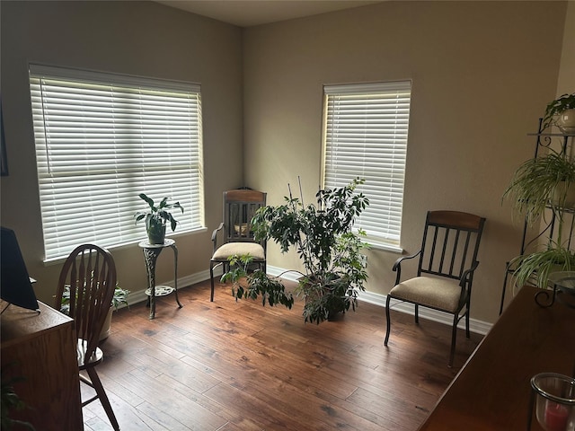 2663 Rodeo Dr, Quinlan, TX 75474 - living area featuring hardwood / wood-style flooring, baseboards, and an office area