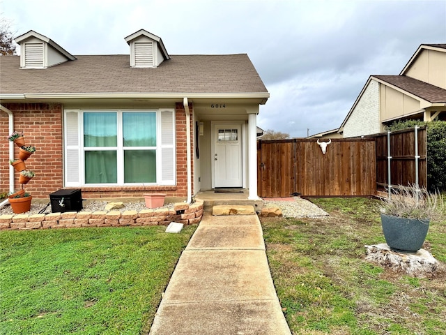6014 Mcafee Dr, The Colony, TX 75056 - view of front of house featuring brick siding and a shingled roof