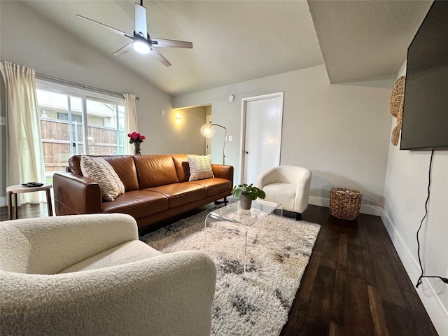 6014 Mcafee Dr, The Colony, TX 75056 - living area with lofted ceiling, a ceiling fan, baseboards, and dark wood-style flooring