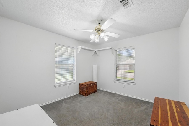 685 Cardinal Ridge Rd, Burleson, TX 76028 - carpeted empty room with ceiling fan, a textured ceiling, and baseboards