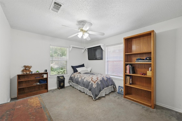 685 Cardinal Ridge Rd, Burleson, TX 76028 - bedroom featuring carpet, a ceiling fan, and a textured ceiling