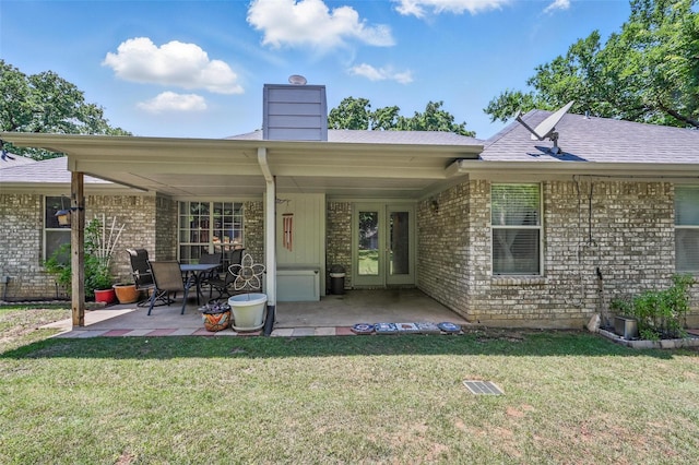685 Cardinal Ridge Rd, Burleson, TX 76028 - back of house with brick siding, a patio, a yard, and a chimney