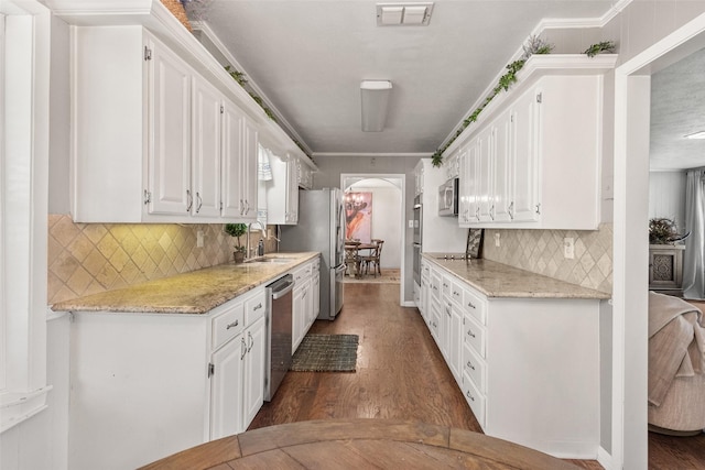 815 N Spikes Rd, Corsicana, TX 75110 - kitchen featuring stainless steel appliances, white cabinetry, and wood finished floors