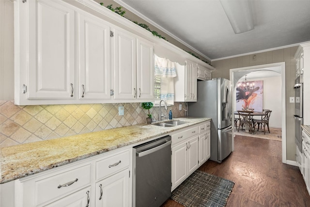 815 N Spikes Rd, Corsicana, TX 75110 - kitchen featuring stainless steel appliances, a sink, white cabinets, dark wood-type flooring, and tasteful backsplash