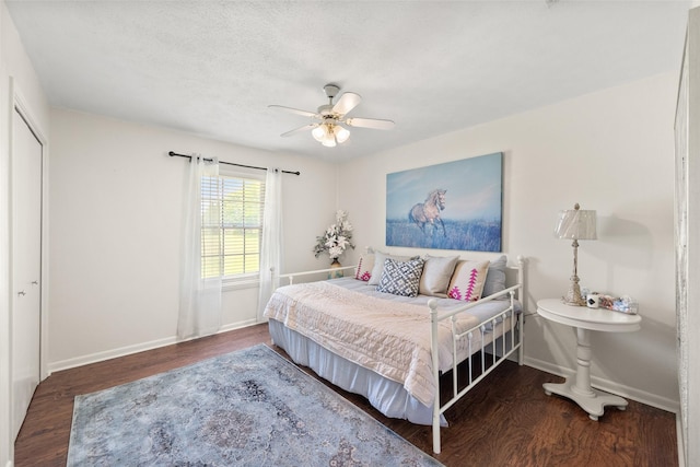 815 N Spikes Rd, Corsicana, TX 75110 - bedroom featuring baseboards, wood finished floors, ceiling fan, and a closet
