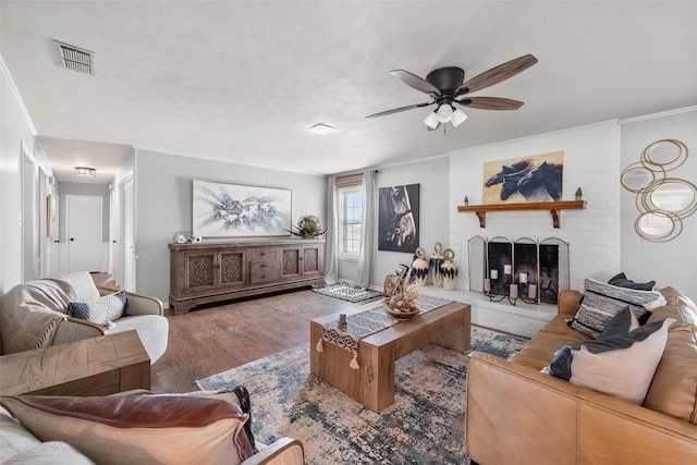 815 N Spikes Rd, Corsicana, TX 75110 - living room with ceiling fan, wood finished floors, and a brick fireplace
