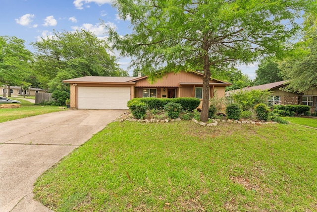 311 Franklin Dr, Euless, TX 76040 - single story home featuring a garage, driveway, a front lawn, and brick siding