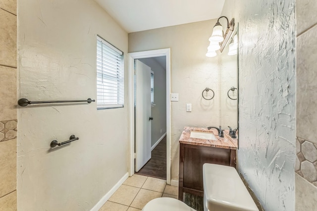 311 Franklin Dr, Euless, TX 76040 - bathroom with toilet, vanity, tile patterned flooring, and baseboards