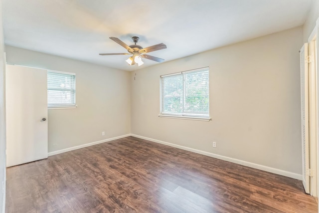 311 Franklin Dr, Euless, TX 76040 - unfurnished bedroom featuring wood finished floors, baseboards, and a ceiling fan
