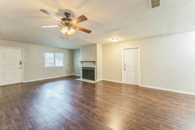 311 Franklin Dr, Euless, TX 76040 - unfurnished living room with dark wood-style floors, a ceiling fan, a fireplace with flush hearth, and baseboards